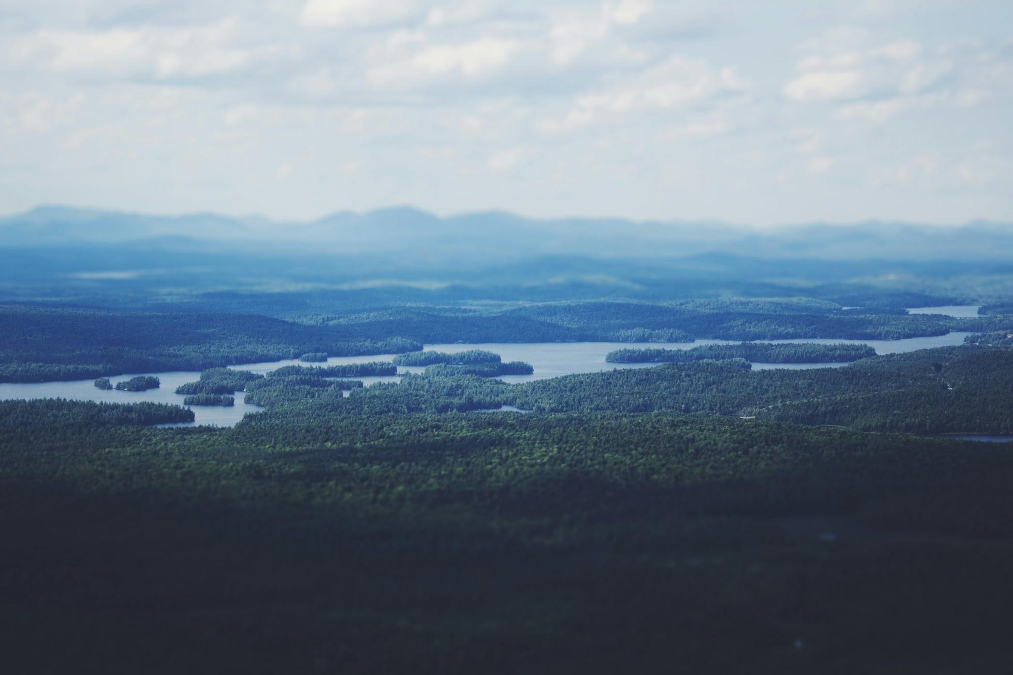 Fog over forested lake islands near Saranac Lake