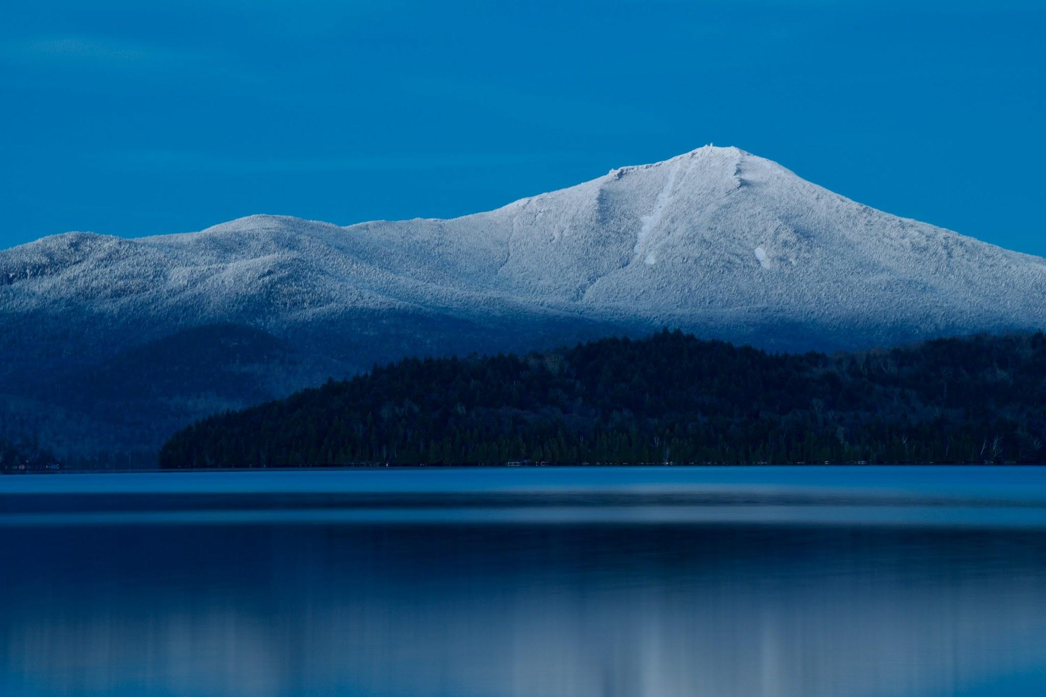 Whiteface Mountain reflected in a calm lake near Lake Placid